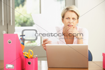 Woman Using Laptop At Home