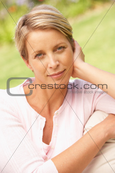 Young Woman Relaxing In Garden