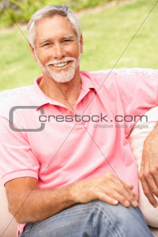 Senior Man Relaxing In Garden