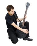 young singer, dressed in black with an electric guitar