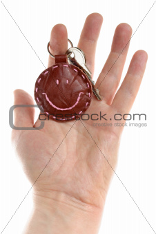 Man's hand with key isolated on white background