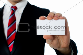 Closeup shot of a man showing business card