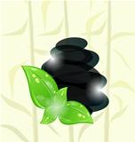 Meditative bamboo background with cairn stones and eco green lea