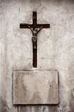 Cross and concrete plate on a wall