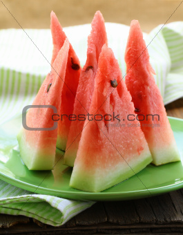 watermelon cut into slices on a plate - fruit dessert