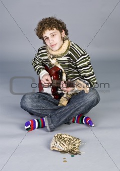 Betiful young man with guitar