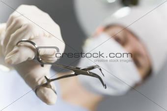 Doctor with forceps