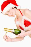 Christmas girl is holding a bottle of champagne