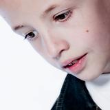 Young boy in thinking pose