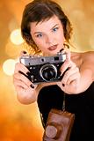 glamorous girl holding a camera