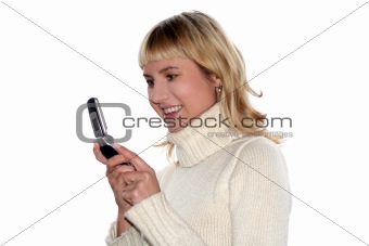 Young blond woman sms by mobile phone. She is happy