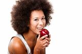 African American  young woman holding and eating an apple
