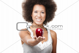 African American  young woman holding and showing a red apple