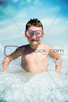 Child and water waves
