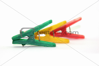 three clothespin with different colors