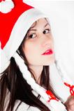 Girl in Santa's hat against white background