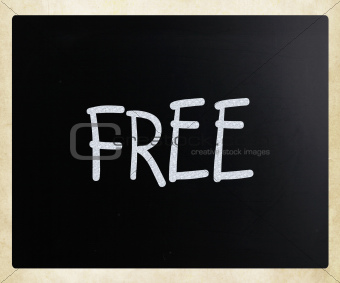 "Free" handwritten with white chalk on a blackboard