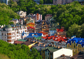 Multicolored houses among the green trees Kiev, Ukraine