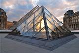 Paris. Glass pyramids at sunset