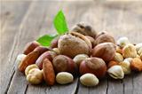 mix nuts - walnuts, hazelnuts, almonds on a wooden table