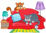 Red sofa with two cartoon cats