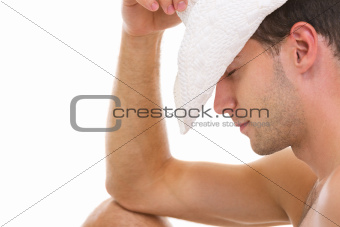 Closeup on young man in hat relaxing on vacation