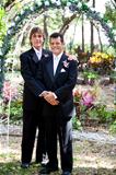 Gay Couple Under Wedding Arch