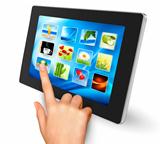 Hand holding touch pad pc and finger touching it s screen with icons