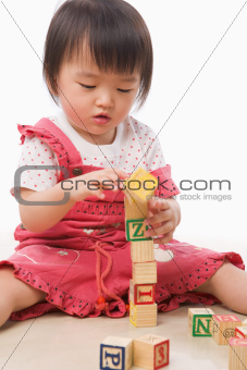 Little Asian girl playing