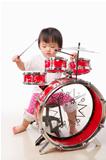 Little girl playing drum