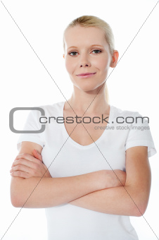 Smiling teenager with folded arms