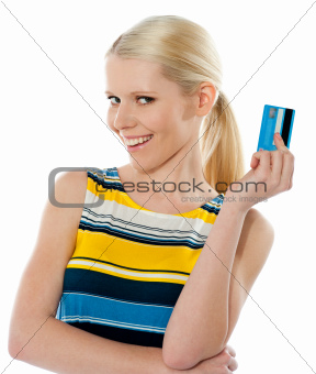 Blond salesgirl posing with credit card