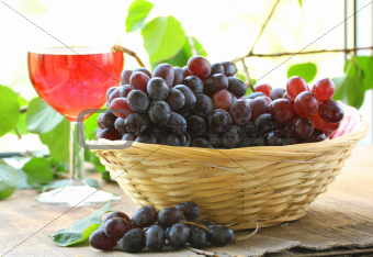 black organic grapes in a wicker basket