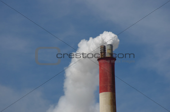 smoky chimney on background of blue sky