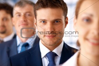 Closeup of Businessman With Colleagues.