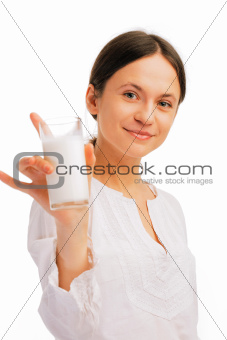 Beautiful woman holding glass of milk