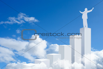 Business man standing on top of a graph bars