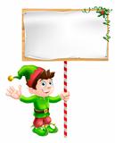 Christmas elf with sign