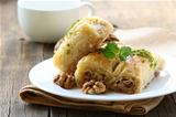 traditional Turkish arabic dessert - baklava with honey and nuts