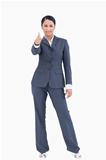 Standing businesswoman giving thumb up