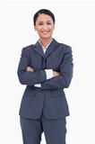 Smiling businesswoman with folded arms