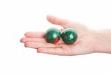 Green chinese balls in hand