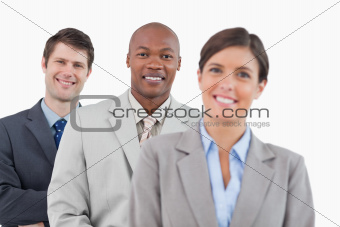 Smiling businesspeople standing together