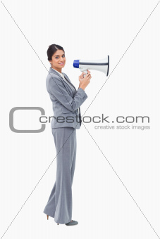 Side view of businesswoman with megaphone