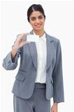Smiling saleswoman presenting blank business card