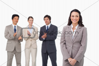 Businesswoman getting applause by colleagues