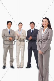 Businesswoman getting applause by her colleagues