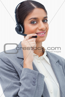 Smiling female call center agent with her headset