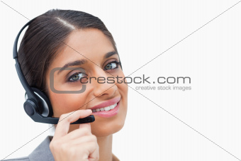 Smiling call center agent with her headset