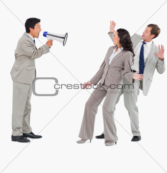 Salesman with megaphone shouting at colleagues